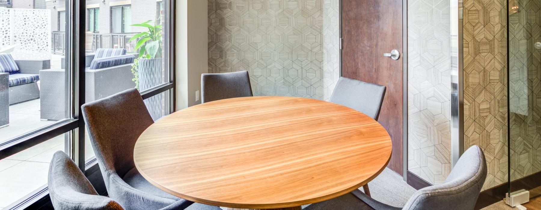 meeting room with table surrounded by chairs